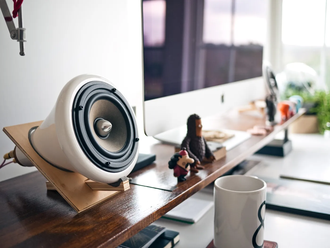A computer workspace with a notebook and desk accessories