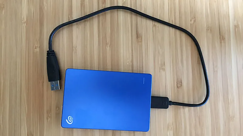 A portable external drive connected by USB