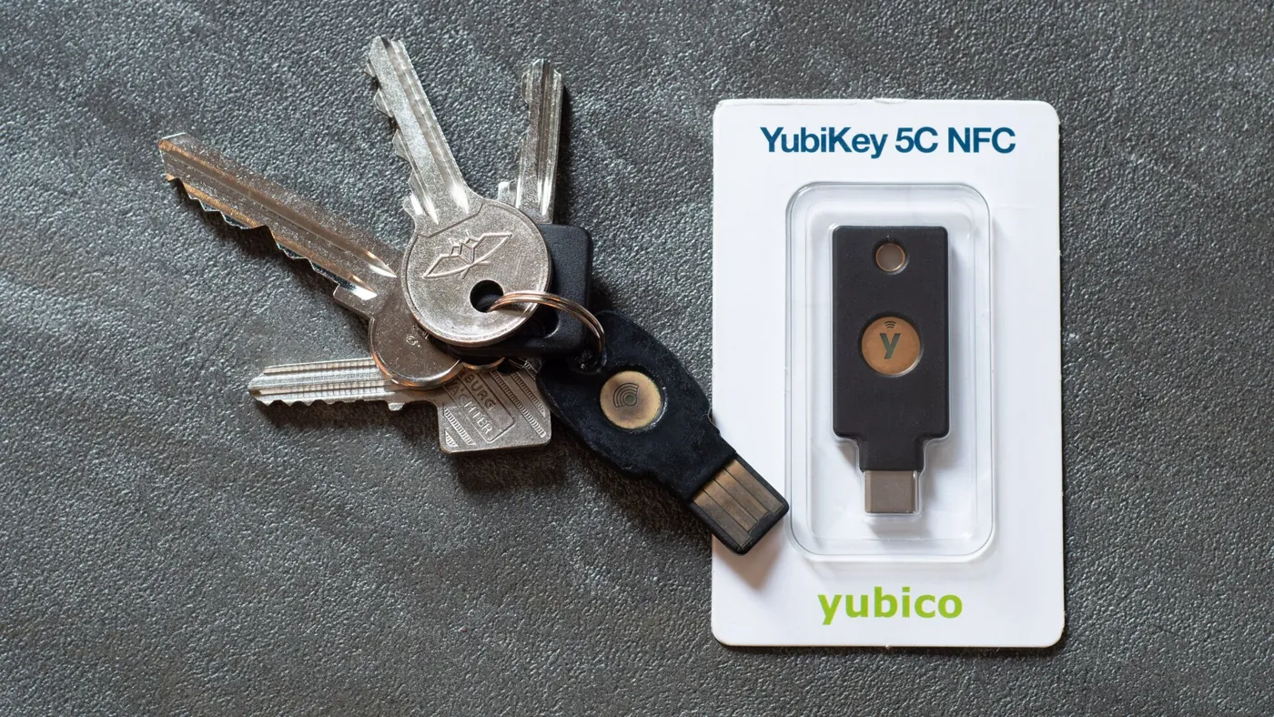 A USB-C security key beside a set of keys